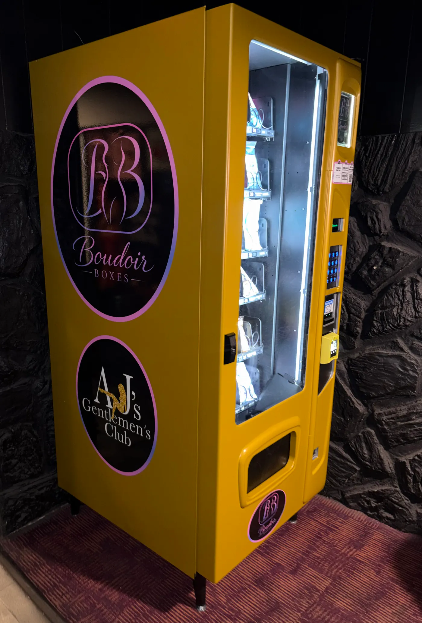 Boudoir Boxes machine lit up and full of product, seen from the side