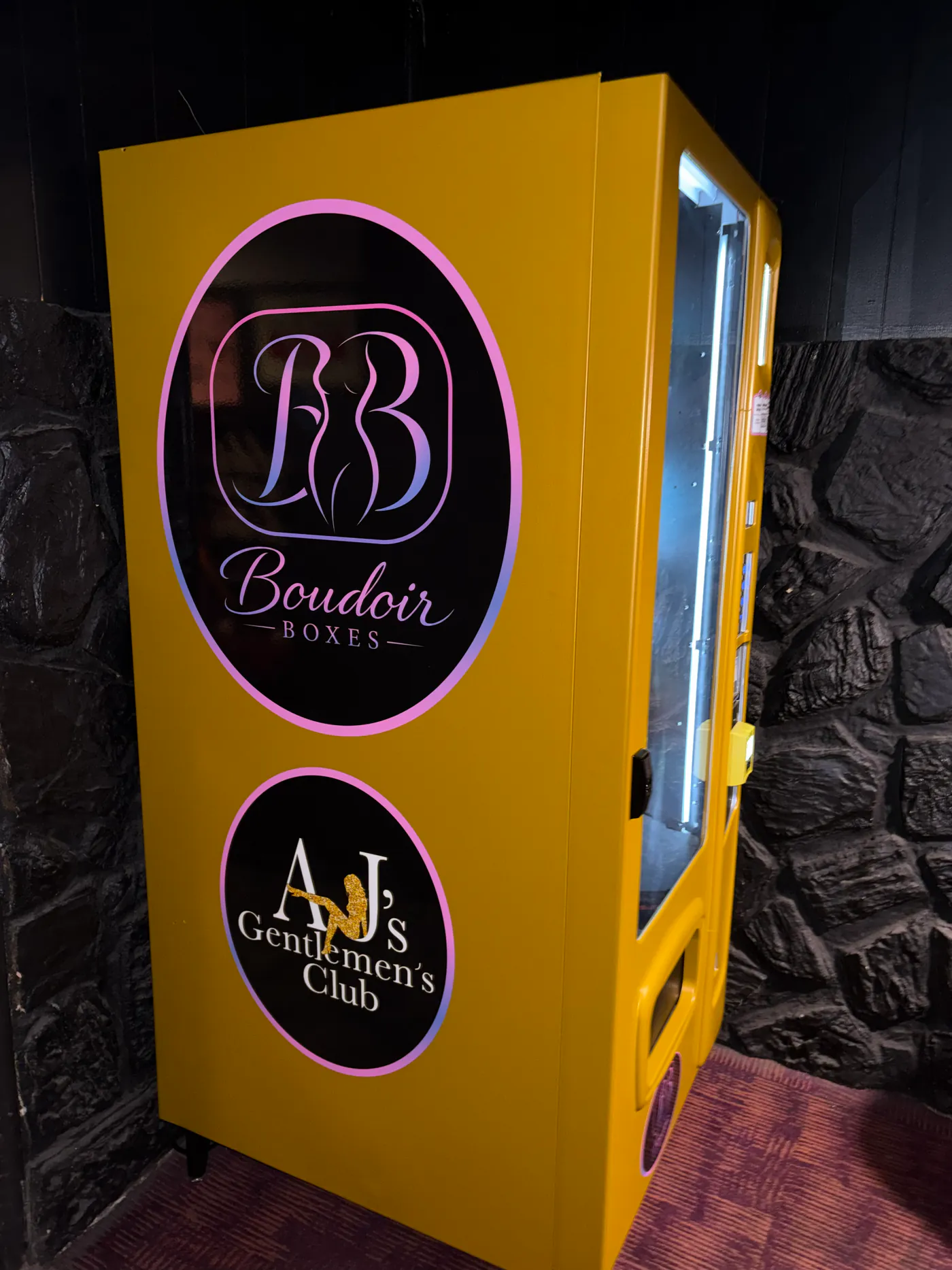 Boudoir Boxes and AJ's Gentlemen's Club branding on the side of the machine