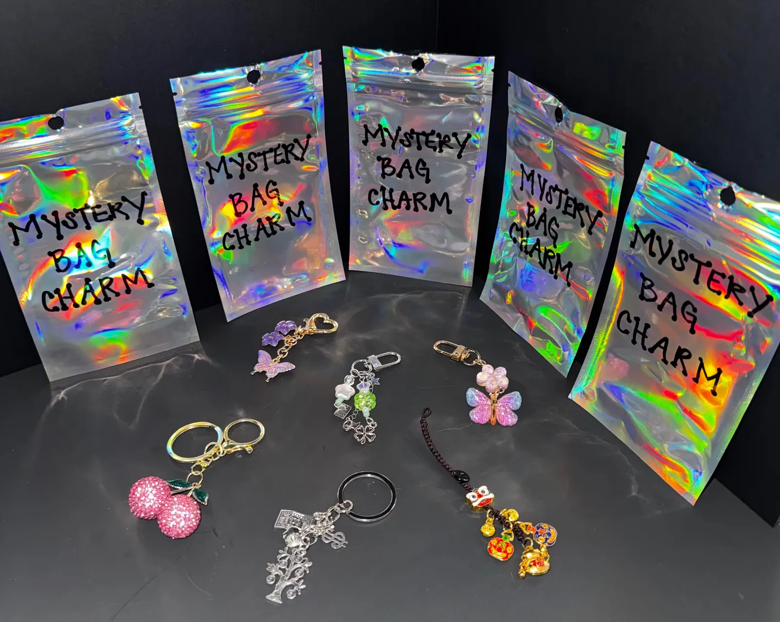 Holographic mystery bags with bag charms and keychains