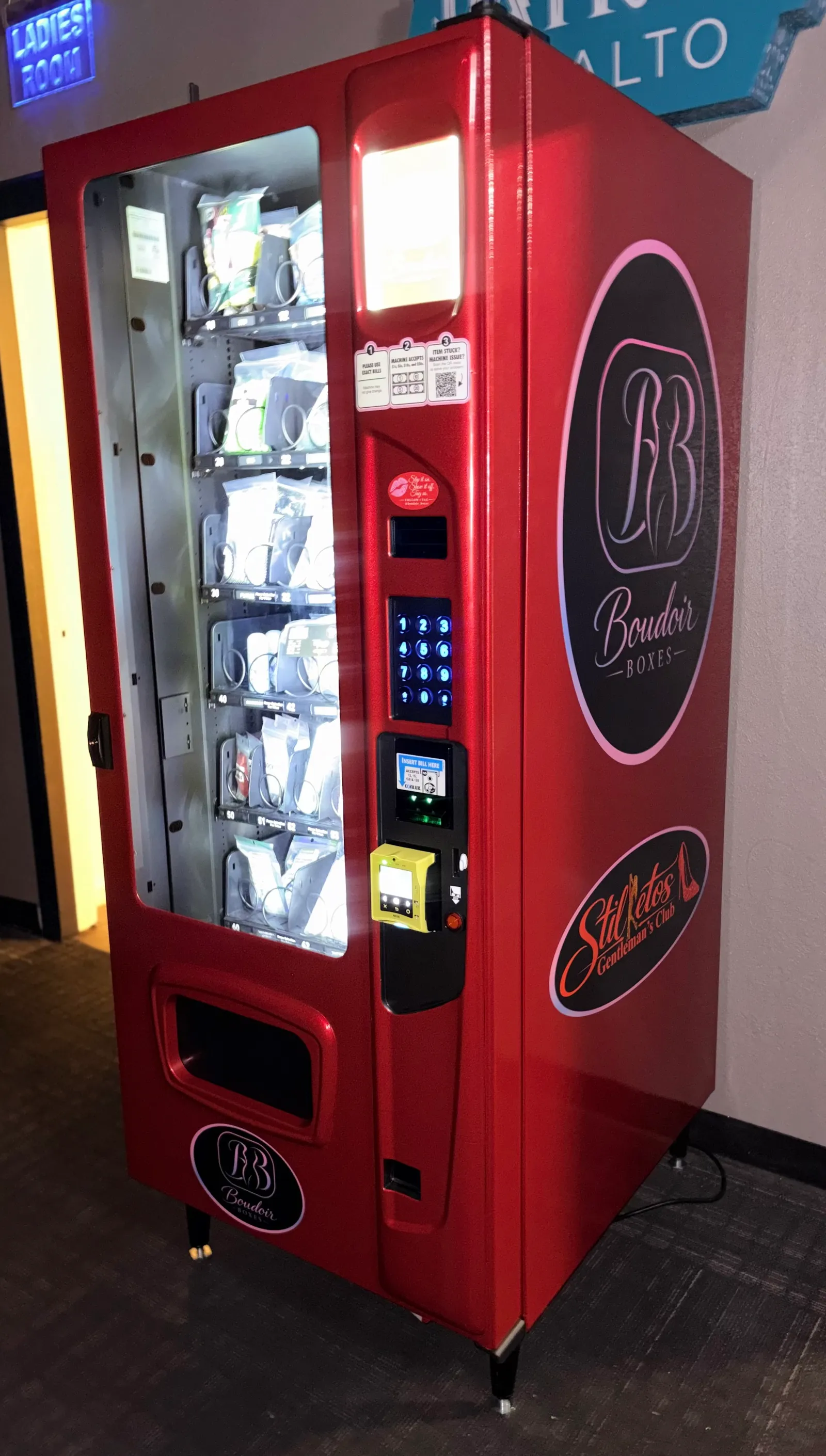 Finished red Boudoir Boxes machine with Stilettos Gentleman's Club branding, installed in Portland
